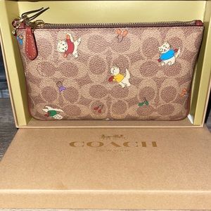 Brand new coach small wristlet tan/rust multi